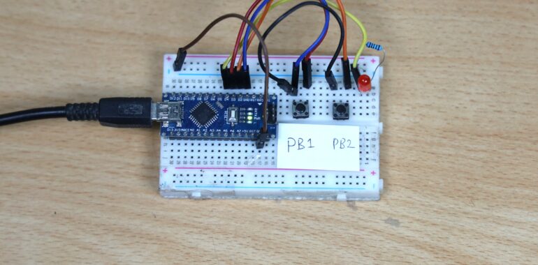 Rangkaian lampu on-off dengan breadboard. Mikroprosesor Arduino Nano ATmega328, 2 buah push button, 1 buah LED dengan resistor 1k